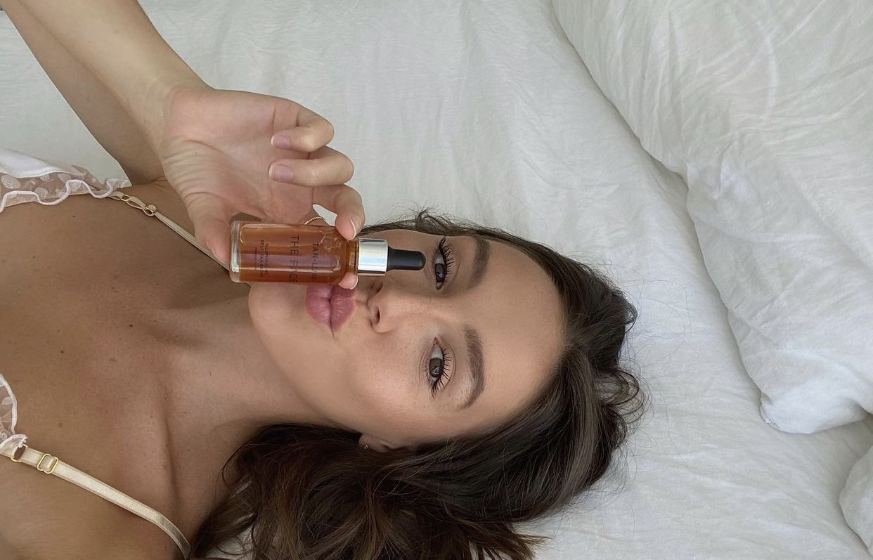 girl with fake tan drops in bed